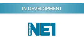 NE1, In Development